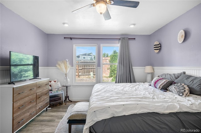 13349 Albion Cir, Thornton, CO 80241 - bedroom with wainscoting, wood finished floors, and a ceiling fan