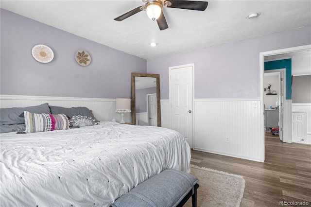 13349 Albion Cir, Thornton, CO 80241 - bedroom with wainscoting, wood finished floors, and ceiling fan