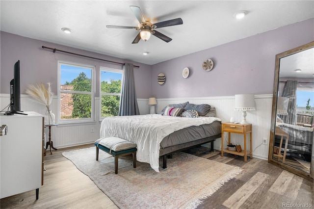 13349 Albion Cir, Thornton, CO 80241 - bedroom with a wainscoted wall, wood finished floors, and a ceiling fan