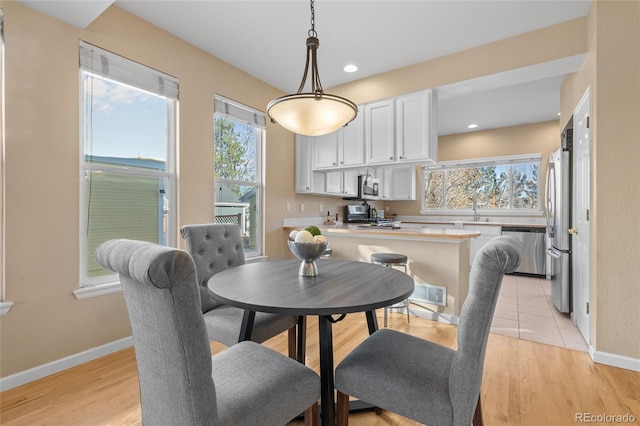 dining room featuring light hardwood / wood-style floors