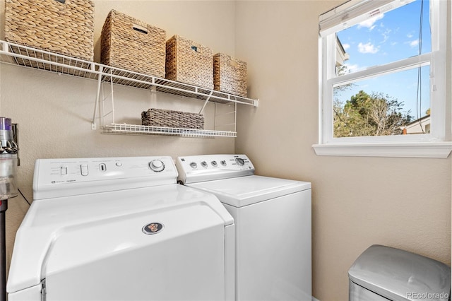 washroom featuring washer and dryer