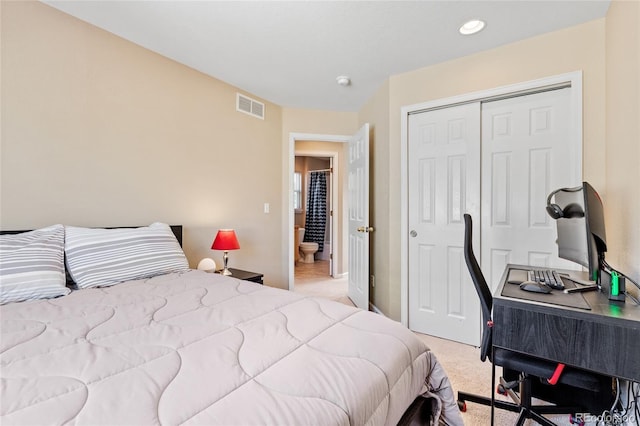 bedroom with light carpet and a closet