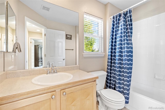 full bathroom featuring vanity, toilet, and shower / bathtub combination with curtain