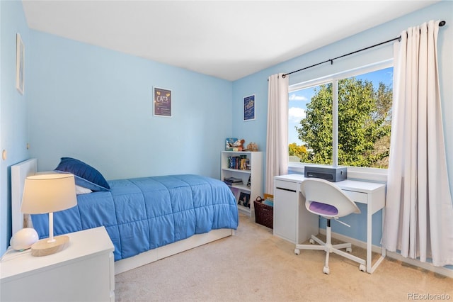 bedroom featuring light colored carpet