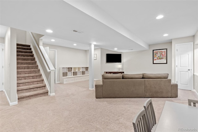 living room featuring light carpet