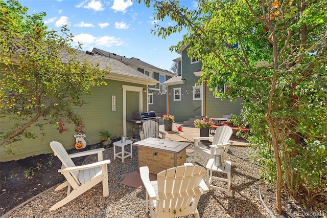 view of patio / terrace with area for grilling and an outdoor fire pit