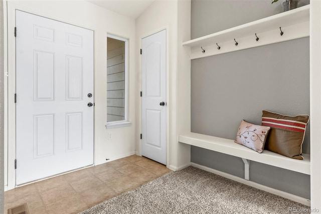 mudroom featuring light carpet