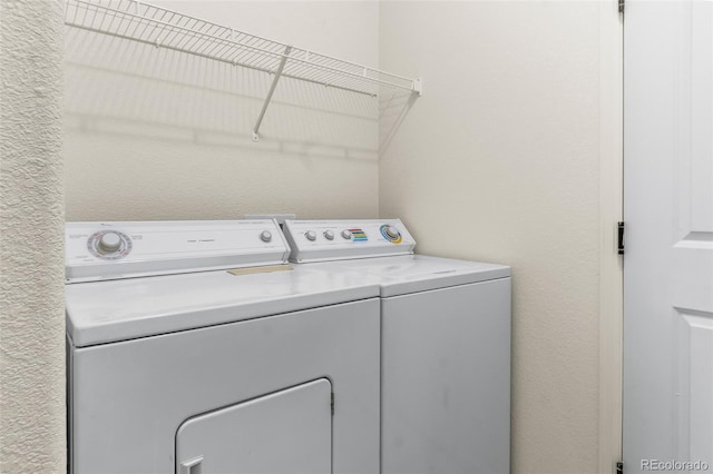 laundry room with washer and clothes dryer