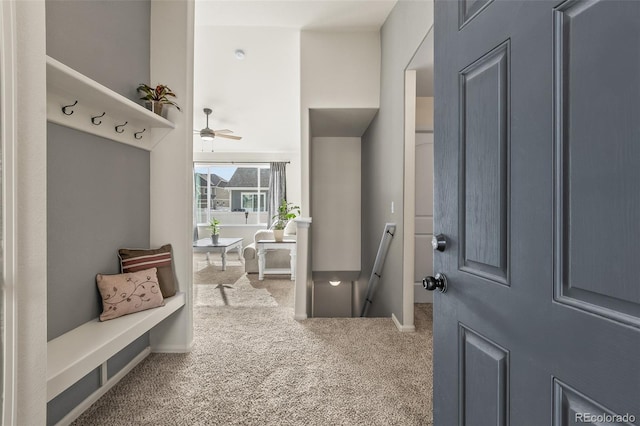 mudroom featuring ceiling fan and carpet floors