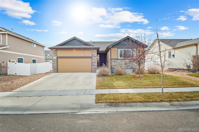 view of front of home featuring a front lawn and a garage