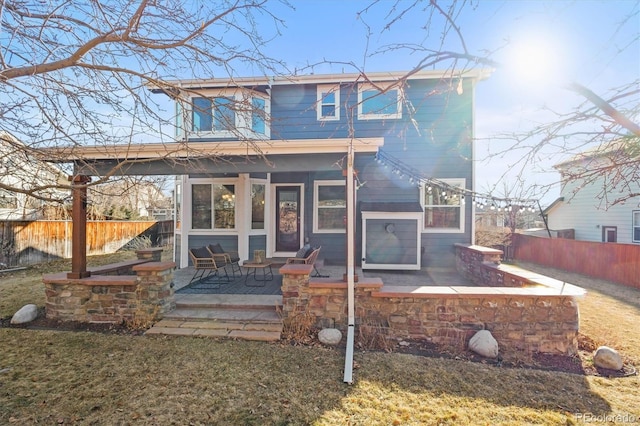 view of front of house featuring fence