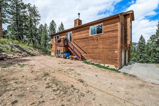 back of house with a garage