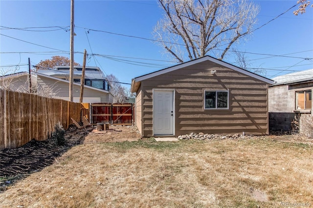 view of outdoor structure with an outbuilding and fence