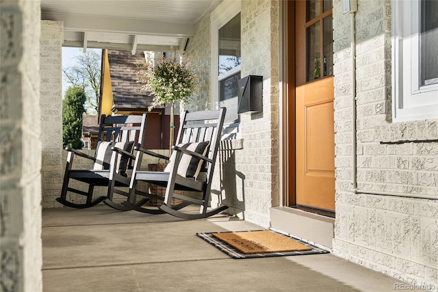 view of exterior entry featuring a porch