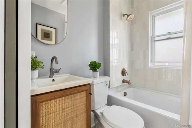 full bathroom with toilet, vanity, and  shower combination