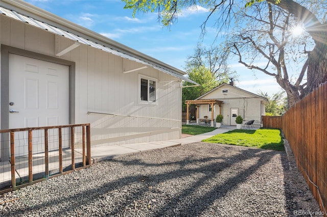 view of yard featuring a patio area and fence