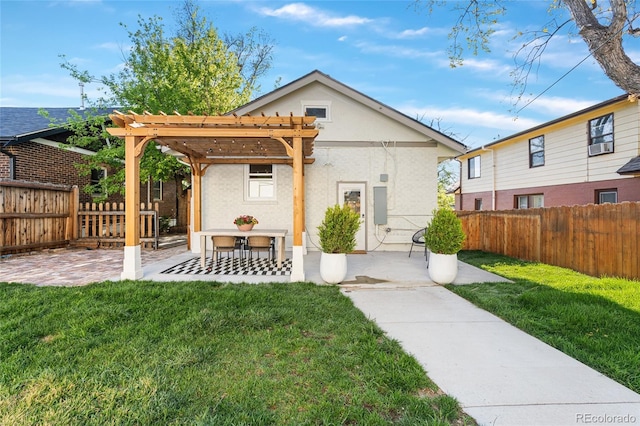view of front of house with a pergola, a patio, and stucco siding