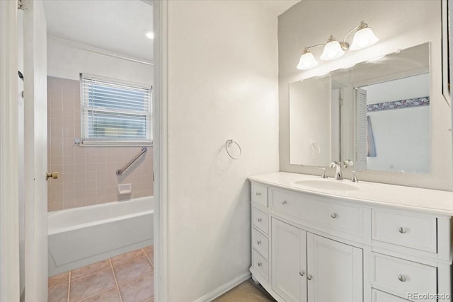 bathroom featuring tile patterned flooring, vanity, and tiled shower / bath