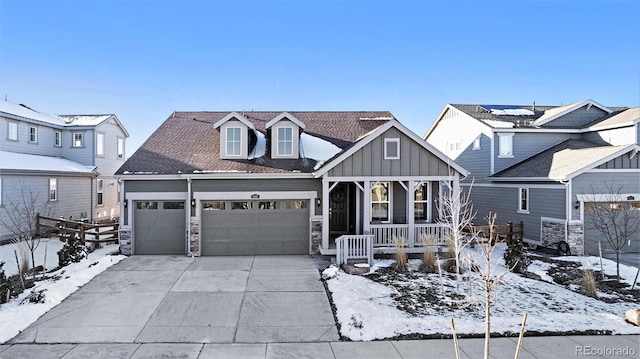 view of front of property with a garage and covered porch