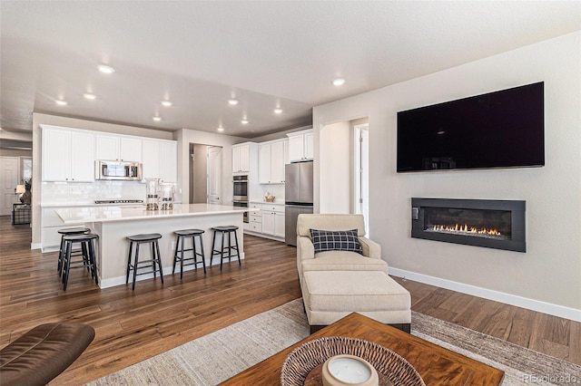 living room featuring dark wood-type flooring