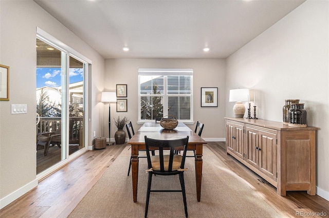 dining area featuring light hardwood / wood-style floors and plenty of natural light