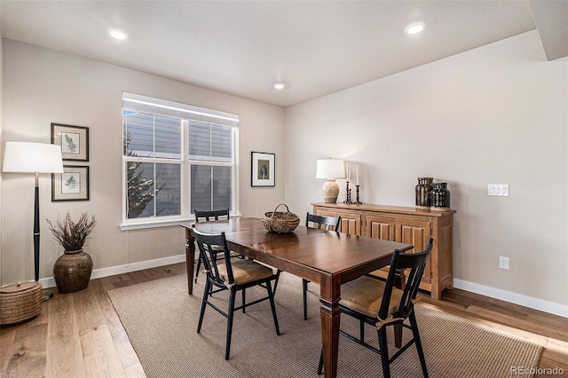 dining area with hardwood / wood-style flooring