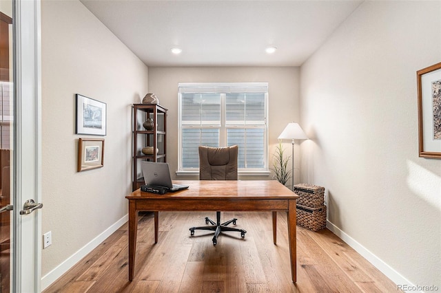 office area with light hardwood / wood-style flooring