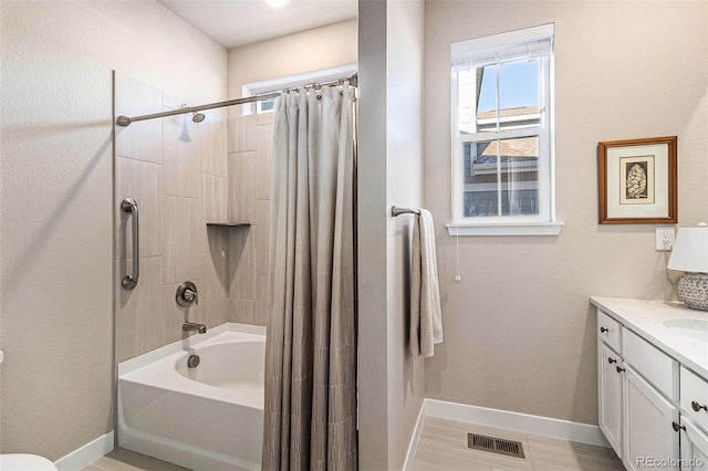 bathroom featuring vanity and shower / bath combo