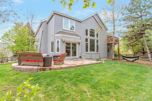 10773 Cougar Rdg, Lone Tree, CO 80124 - rear view of house with stucco siding and a patio area