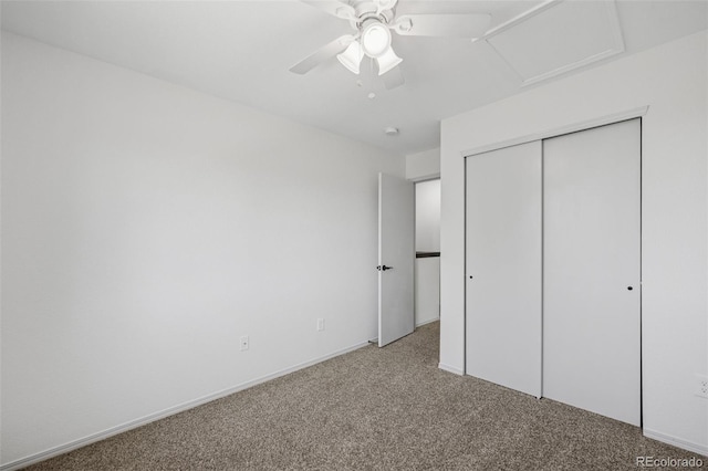 unfurnished bedroom with carpet floors, a closet, ceiling fan, and baseboards