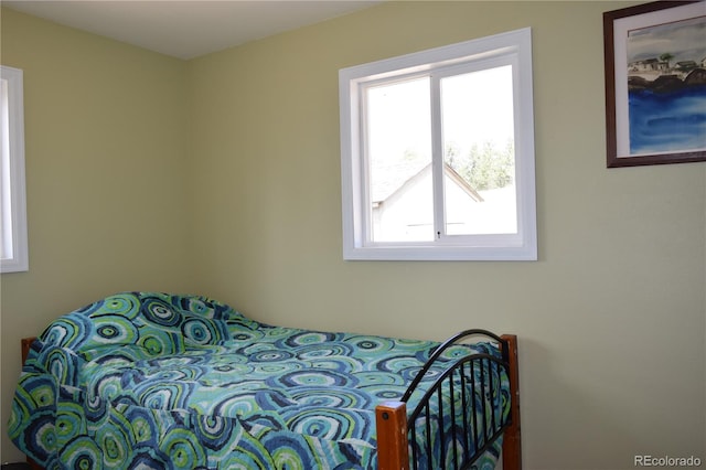 bedroom featuring multiple windows