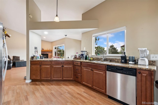 3390 S Ensenada Way, Aurora, CO 80013 - kitchen featuring stainless steel dishwasher, light wood-type flooring, high vaulted ceiling, plenty of natural light, and brown cabinetry