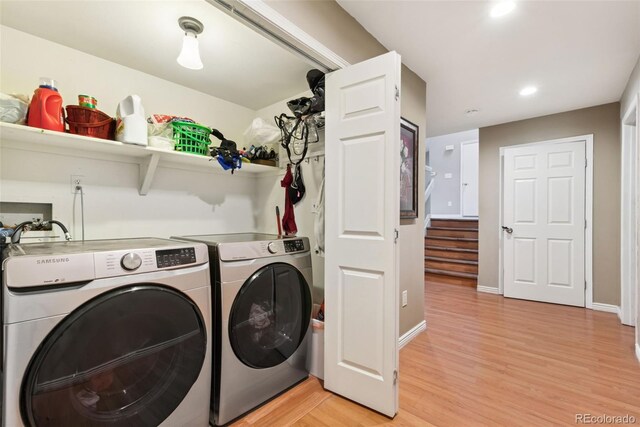 3390 S Ensenada Way, Aurora, CO 80013 - washroom with washer and dryer, light wood finished floors, and recessed lighting