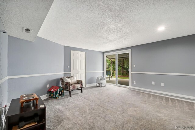 3390 S Ensenada Way, Aurora, CO 80013 - living area with a textured ceiling and carpet