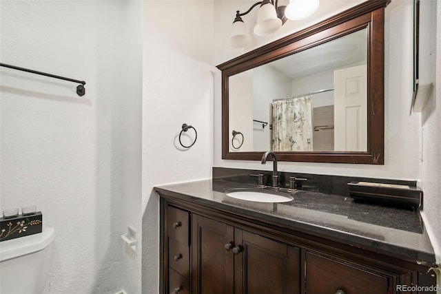 3390 S Ensenada Way, Aurora, CO 80013 - bathroom featuring vanity and toilet
