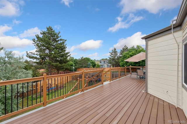 3390 S Ensenada Way, Aurora, CO 80013 - wooden terrace featuring outdoor dining space