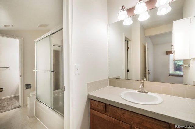 5010 Sunsuite Trl, Colorado Springs, CO 80917 - bathroom with vanity, enclosed tub / shower combo, and tile patterned flooring