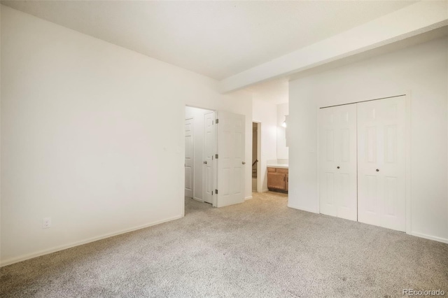 5010 Sunsuite Trl, Colorado Springs, CO 80917 - unfurnished bedroom featuring light colored carpet, ensuite bath, a closet, and baseboards