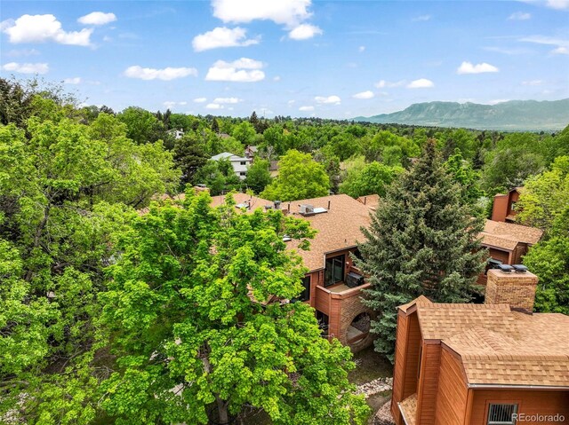 5010 Sunsuite Trl, Colorado Springs, CO 80917 - aerial view of a heavily wooded area and mountains