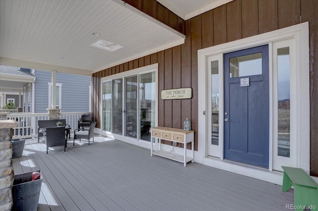 entrance to property featuring board and batten siding