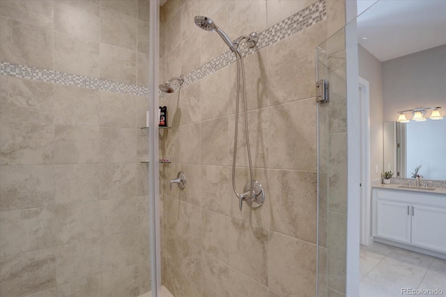 full bath with a stall shower and vanity