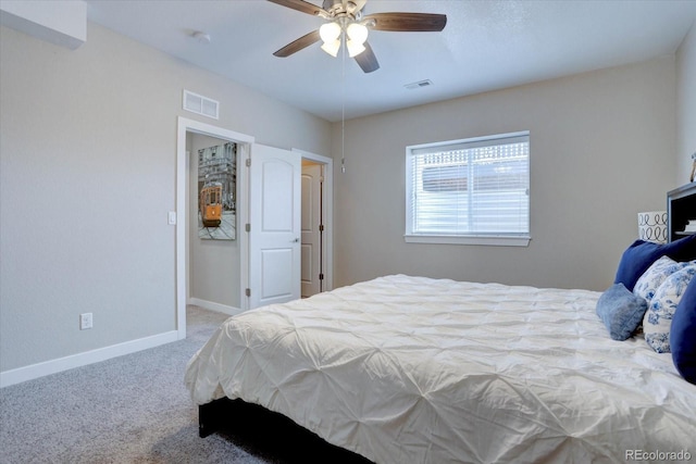 bedroom featuring visible vents, carpet floors, baseboards, and a ceiling fan