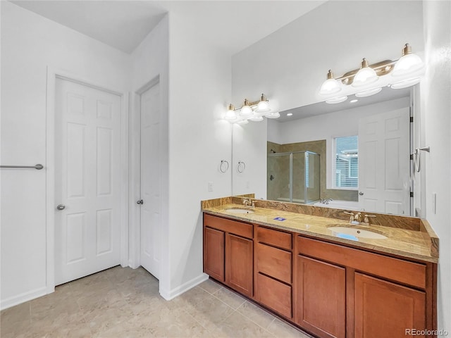 bathroom with tile patterned floors, a shower with shower door, and vanity