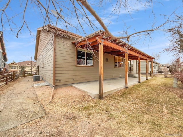 view of home's exterior with cooling unit and a patio