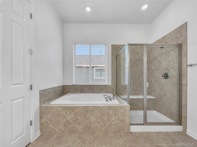 bathroom with shower with separate bathtub