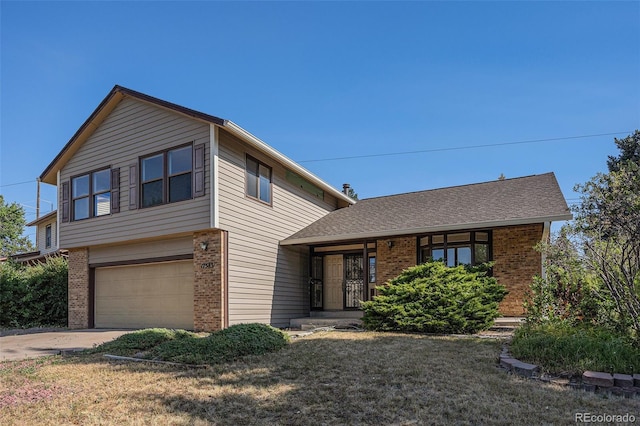 17583 E Belleview Pl, Centennial, CO 80015 - view of front of property with brick siding, an attached garage, and concrete driveway