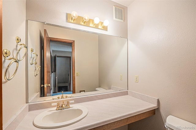 17583 E Belleview Pl, Centennial, CO 80015 - bathroom featuring toilet and vanity