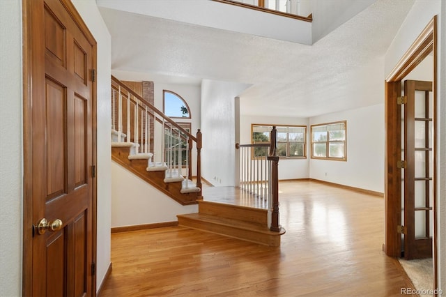 foyer entrance with light hardwood / wood-style flooring