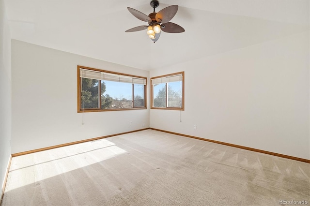 carpeted spare room with ceiling fan