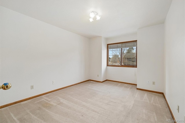 unfurnished room with light colored carpet